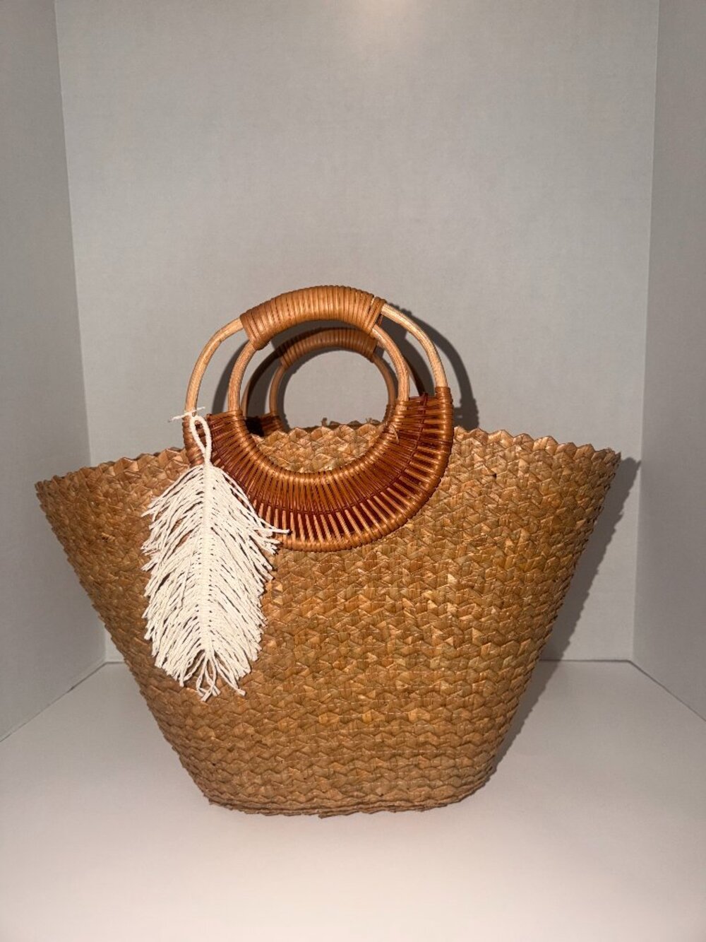 Woven Straw Tote Bag with Bamboo Handles & Feather Charm